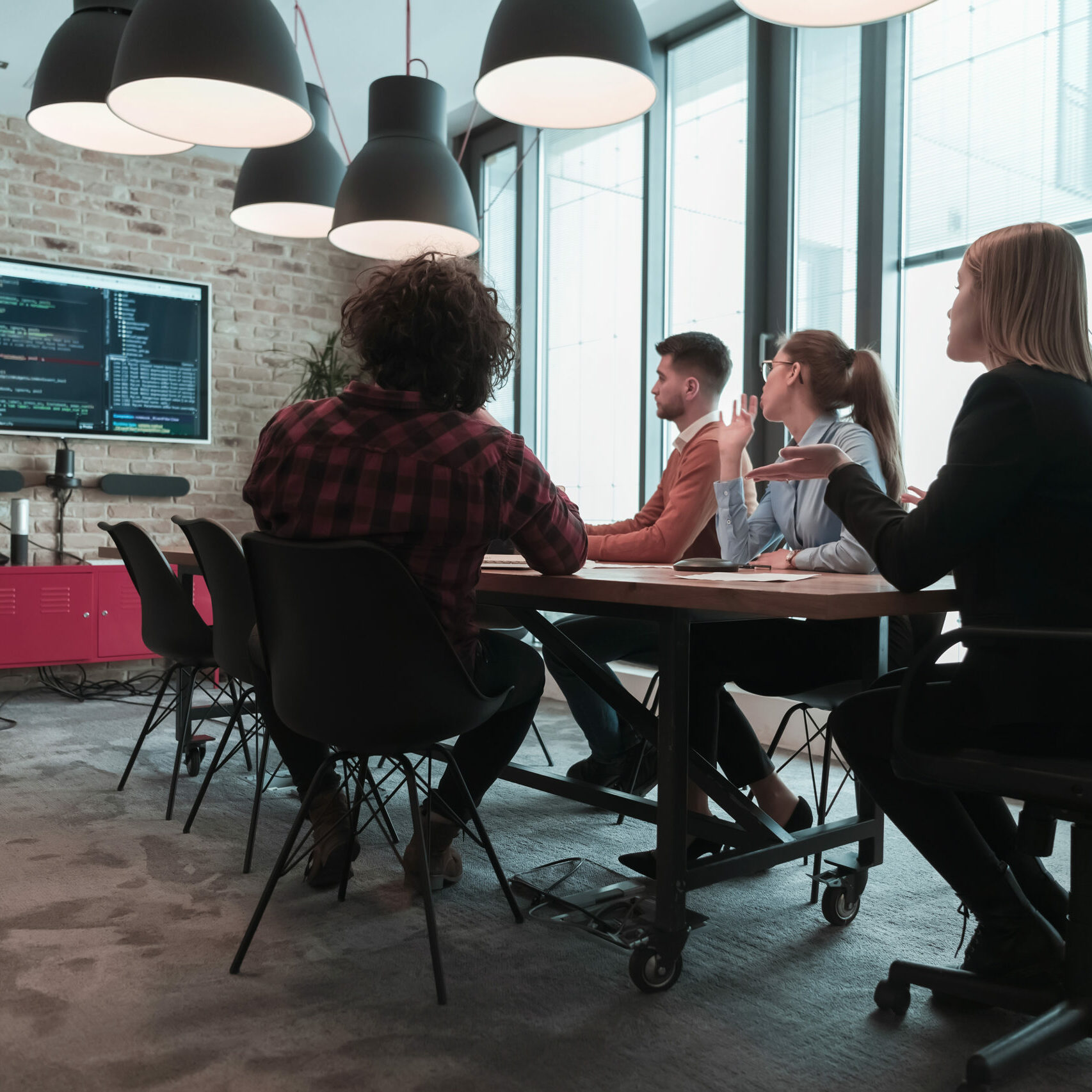 Leader give a business presentation at an office conference meeting, businessman coach mentor explains graph chart on board corporate group workshop training in the boardroom. Selective focus. High-quality photo